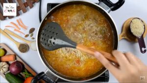 Afghani Pulao using slotted spoon